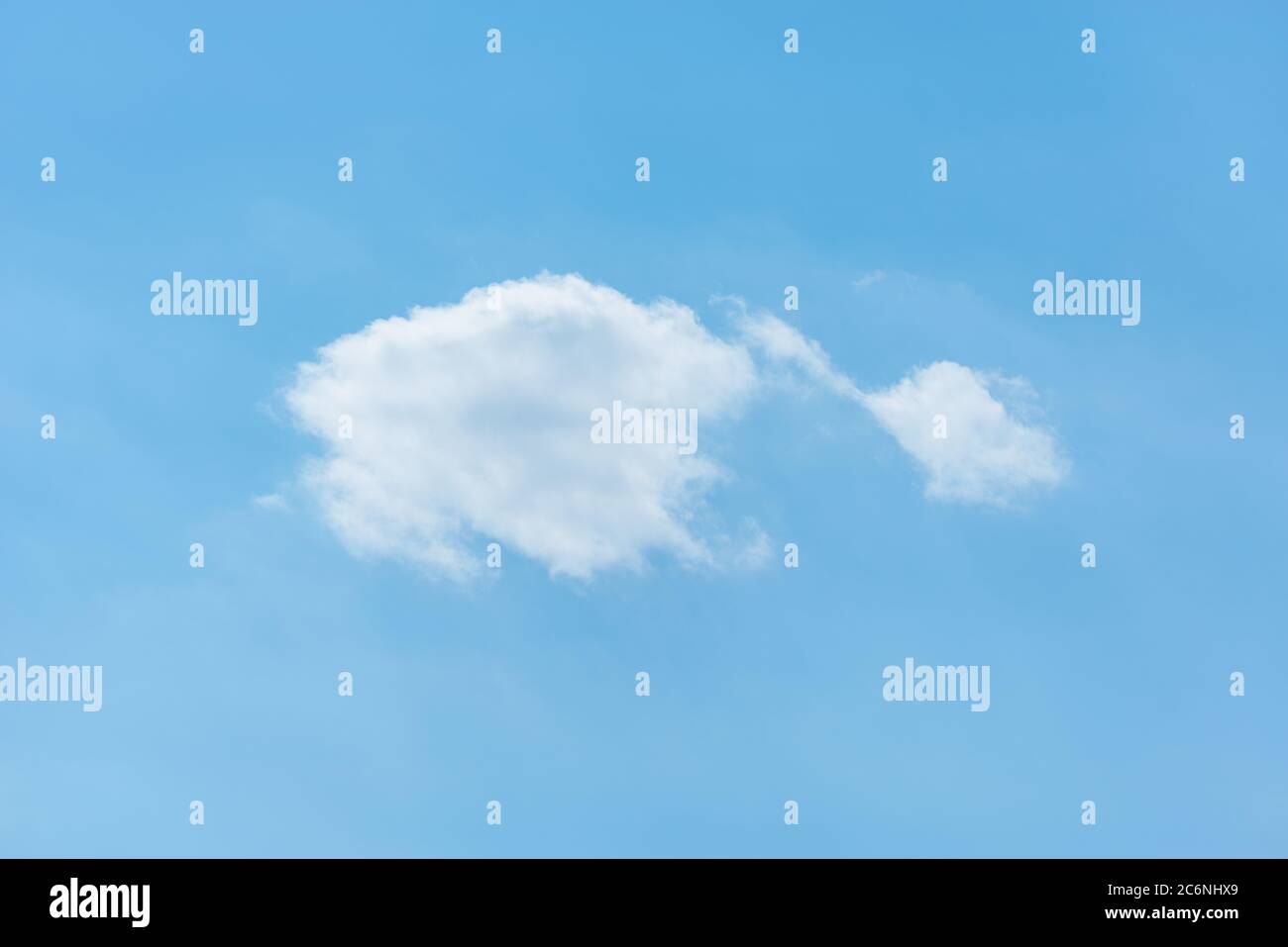 Small clouds on the blue sky at day time. Stock Photo