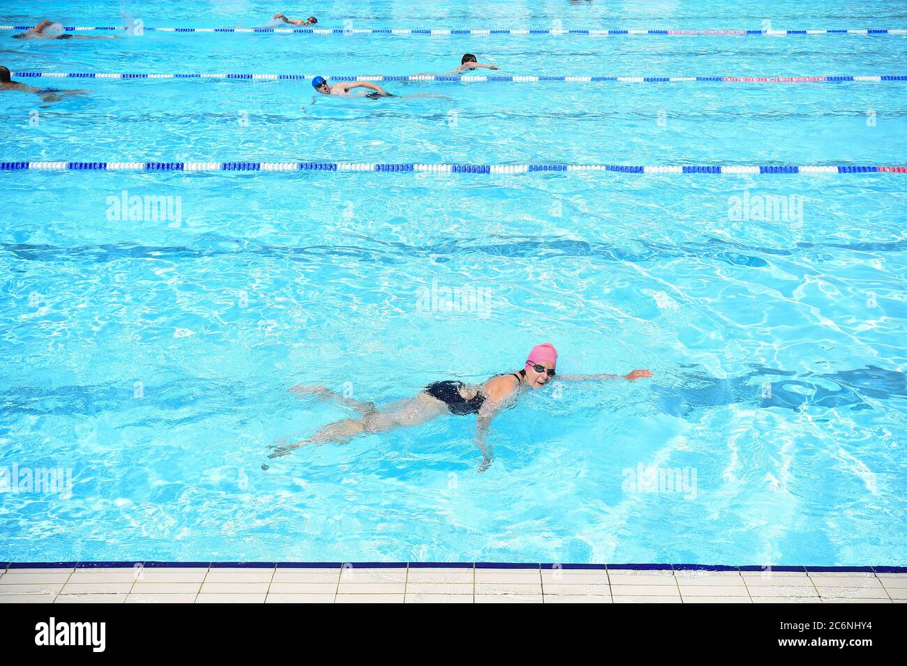 Swimmers at the Charlton Lido & Lifestyle Club, Hornfair Park, London, as outdoor swimming pools reopen to the public on Saturday as the easing of coronavirus lockdown restrictions continues in England. Stock Photo