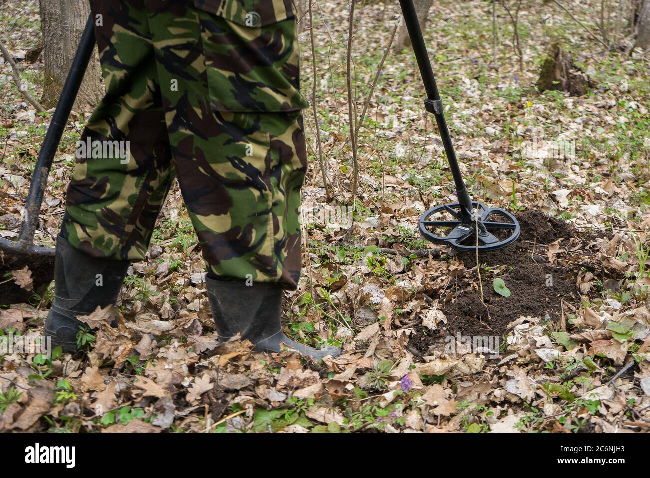 Metal Detector In The Forest And A Man Digging Coins Search Old Coins Or Metals Stock Photo Alamy