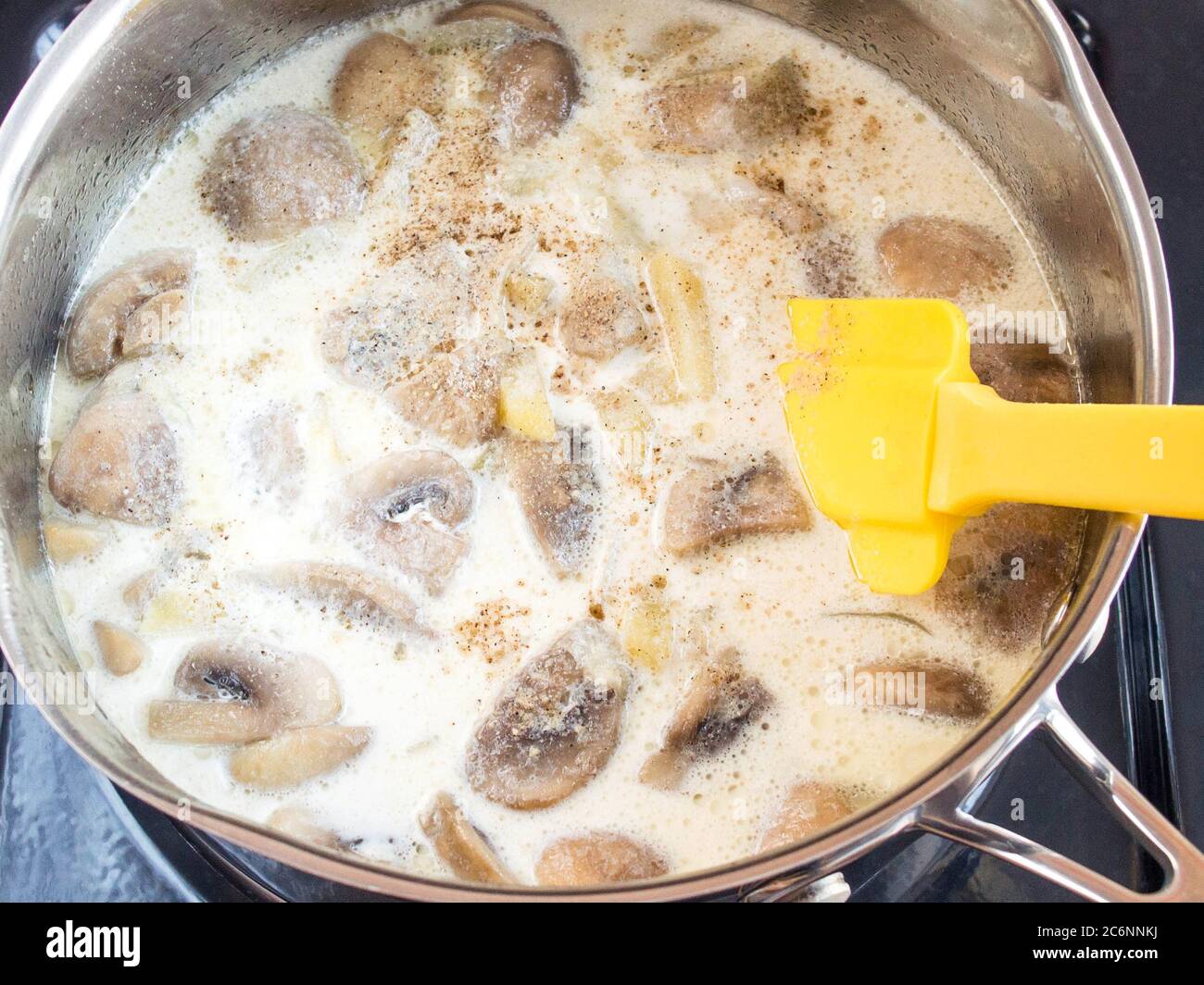 Grind the puree soup ingredients. Mushrooms and potatoes. Cooking cream soup. Stock Photo