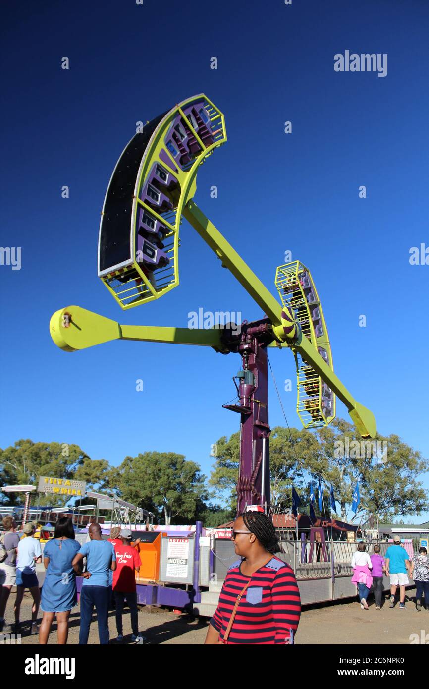 Looping Starship in an amusement park with people around Stock Photo