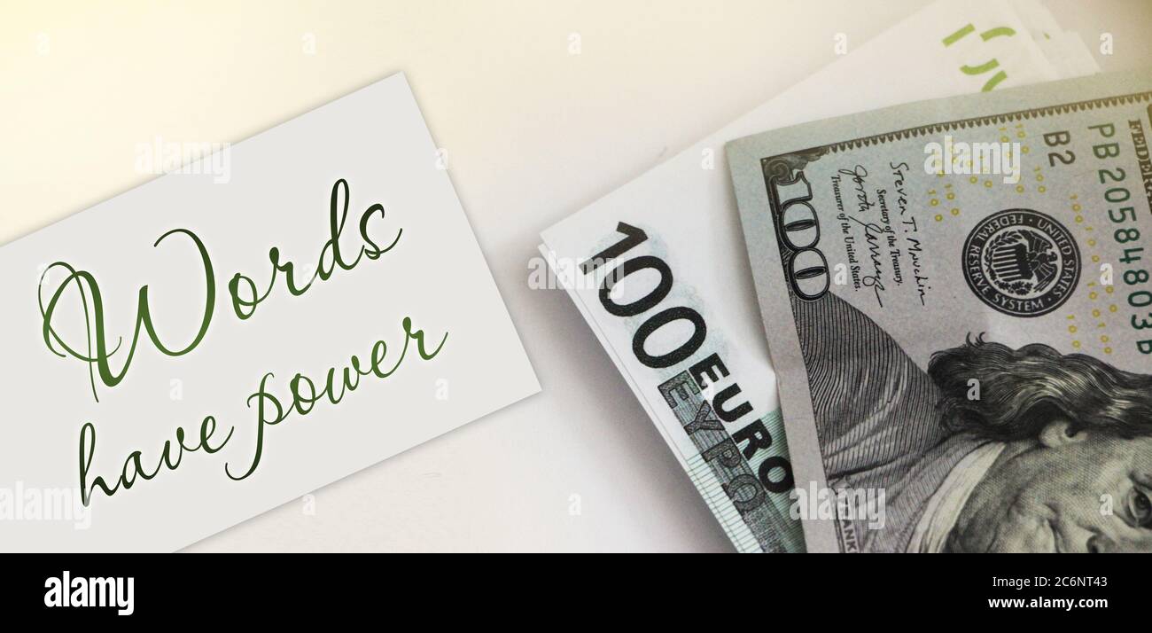 Words Have Power written oncard, 100 Euro bill and 100 dollar banknote. concept Stock Photo