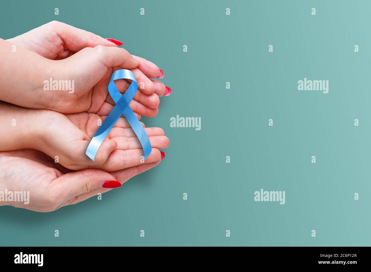 blue ribbon representing an annual event during the month of November to raise awareness of men's health issues and prostate cancer with copy space Stock Photo