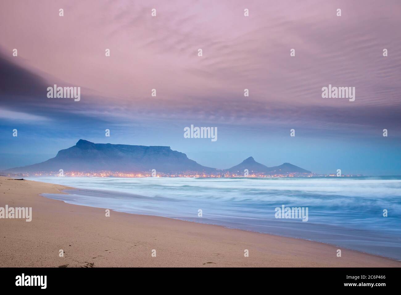 View of Table Mountain at sunrise, Cape Town, South Africa from Milnerton Beach coastline Stock Photo