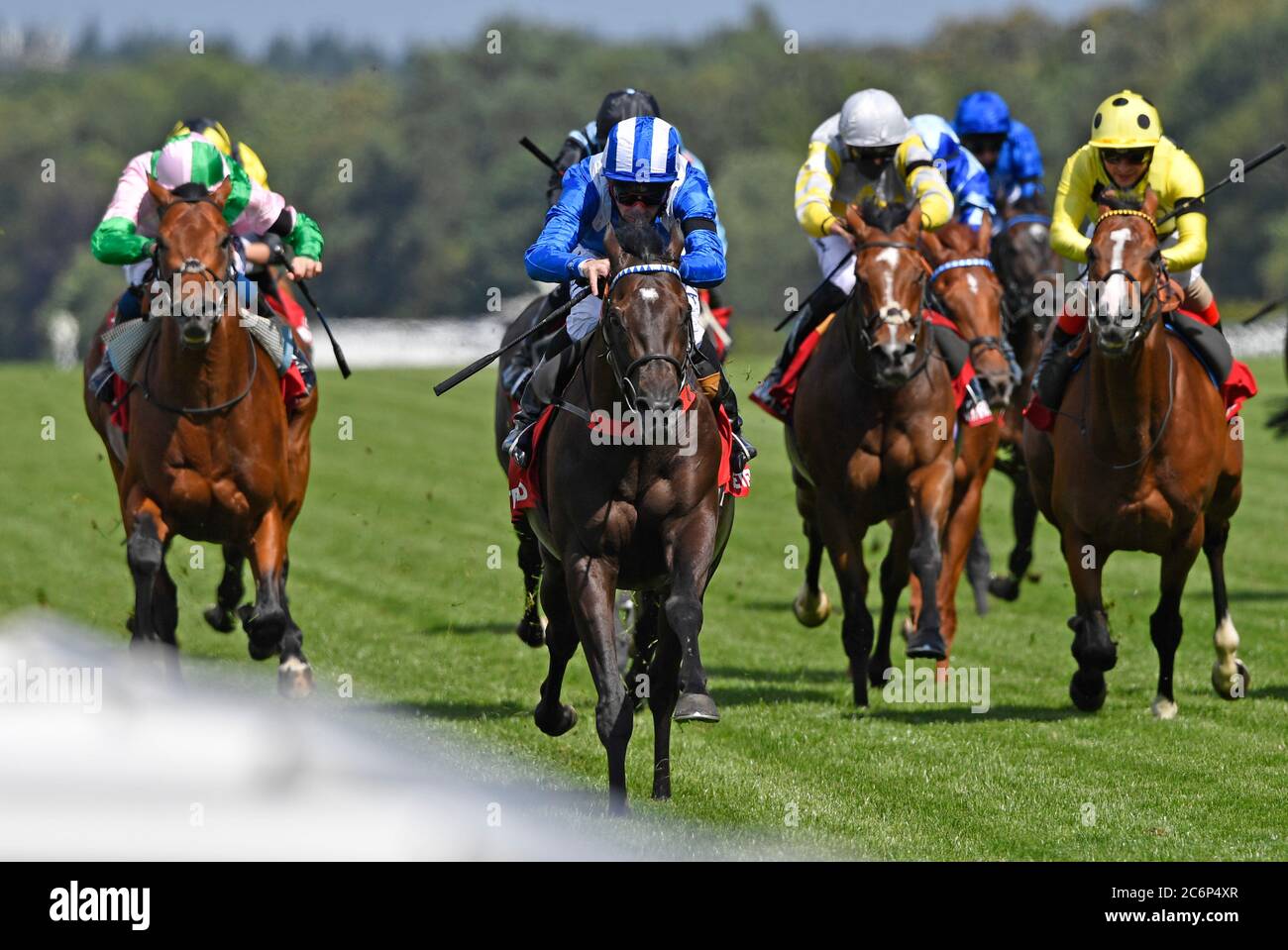 Mohaather ridden by Dane O'Neill (centre) wins the Betfred Summer Mile Stakes at Ascot Racecourse, Berkshire. Stock Photo