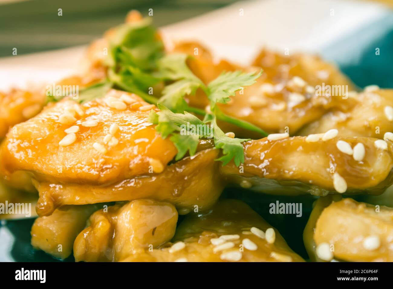 Fried Chicken with Garlic and Pepper and Coriander in Dish with Natural Light on Center Frame in Vintage Tone Stock Photo
