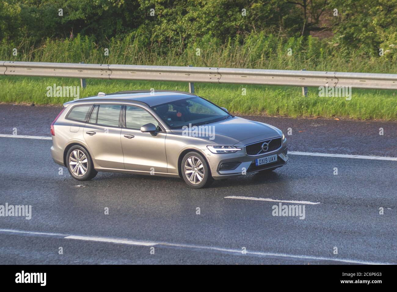 2019 beige Volvo V60 Momentum D3; Vehicular traffic moving vehicles, cars driving vehicle on UK roads, motors, motoring on the M6 motorway highway network. Stock Photo
