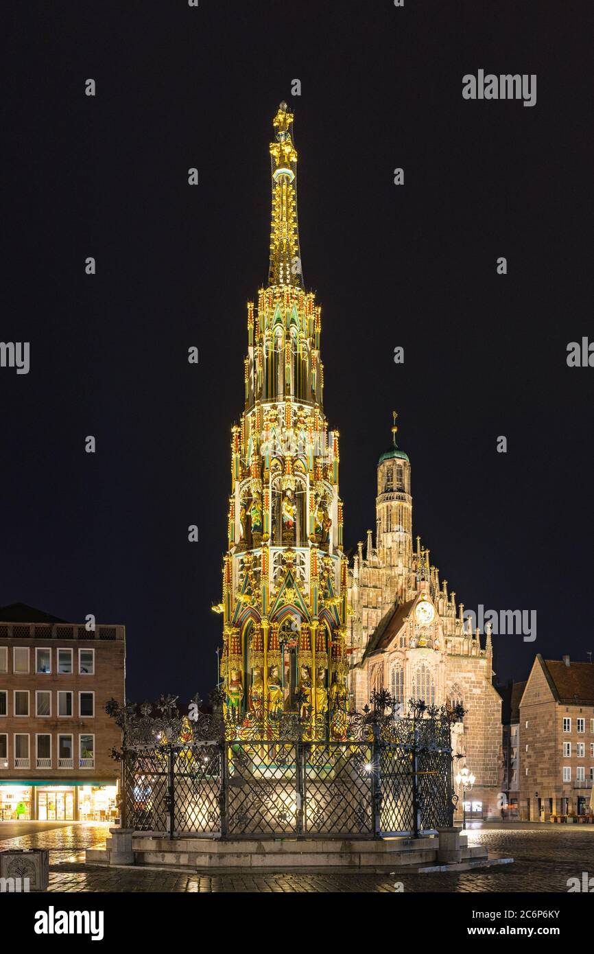 Nuremberg beautiful fountain (German Schöner Brunnen) and Church of our lady (German