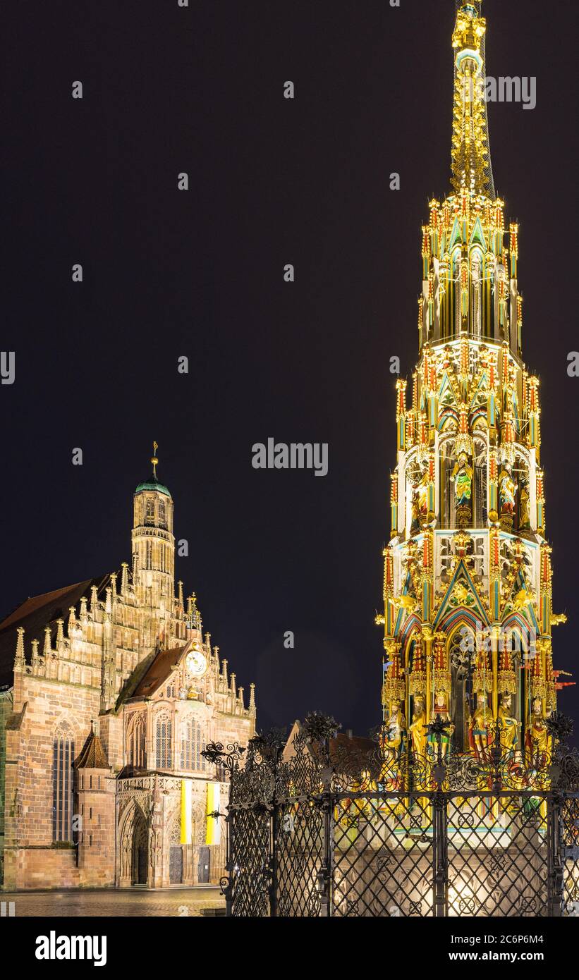 Germany Nuremberg view of beautiful fountain (Schoener Brunnen) and Church of our lady (Frauenkirche) at the main market Stock Photo