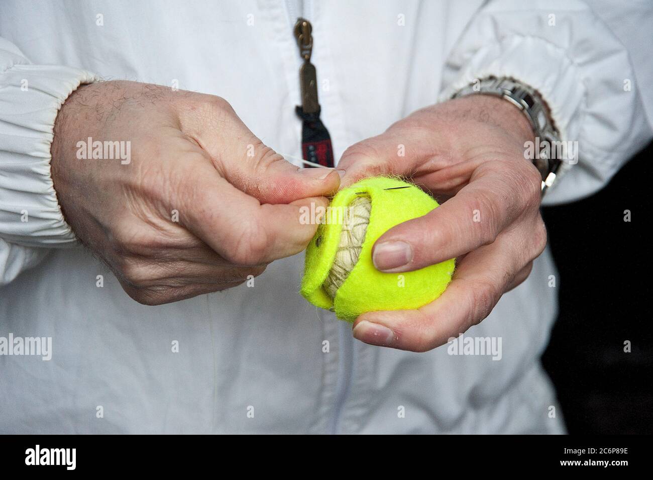 sewing real tennis ball Stock Photo