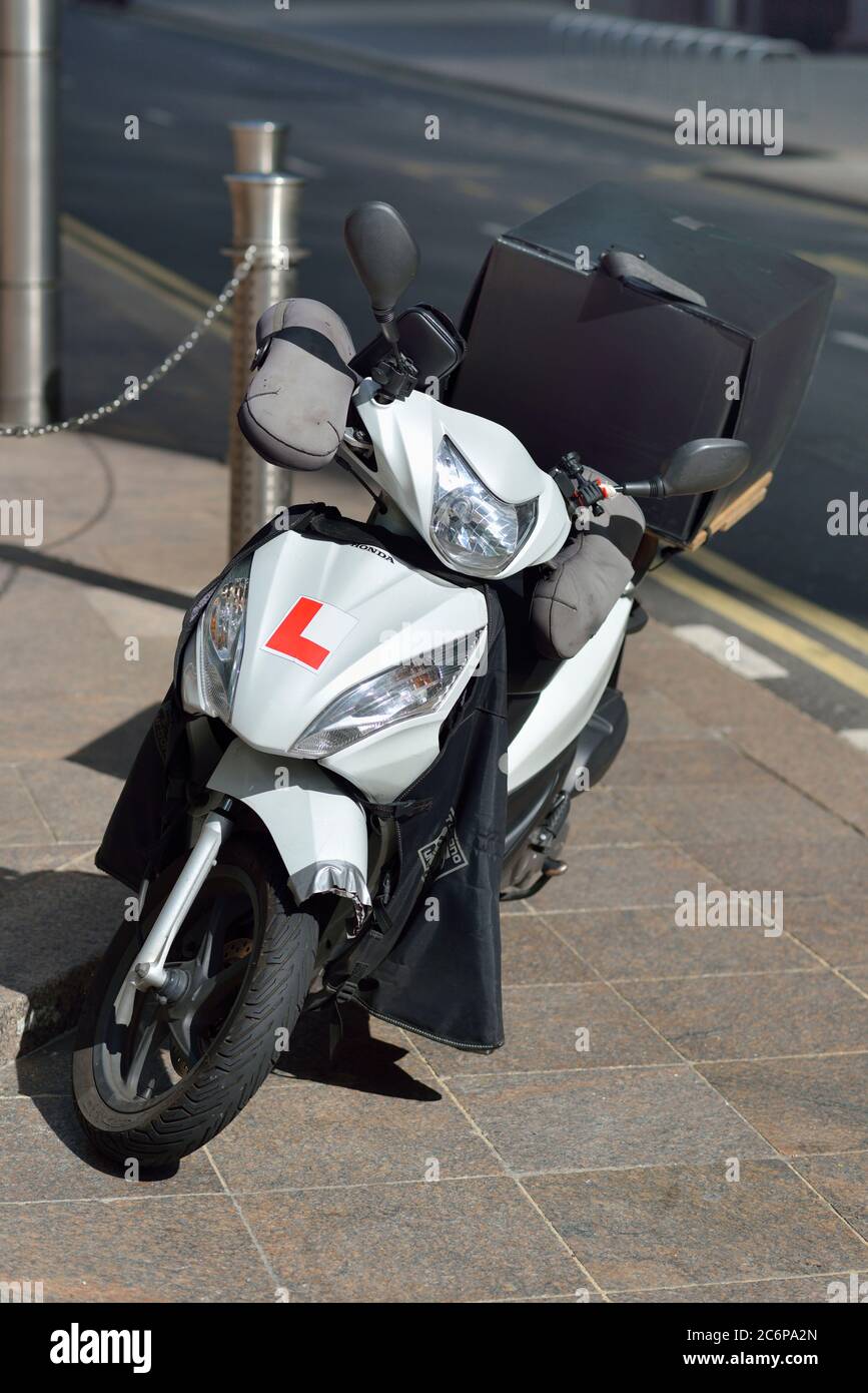 Takeaway Delivery scooter, Canary Wharf, East London, United Kingdom Stock Photo