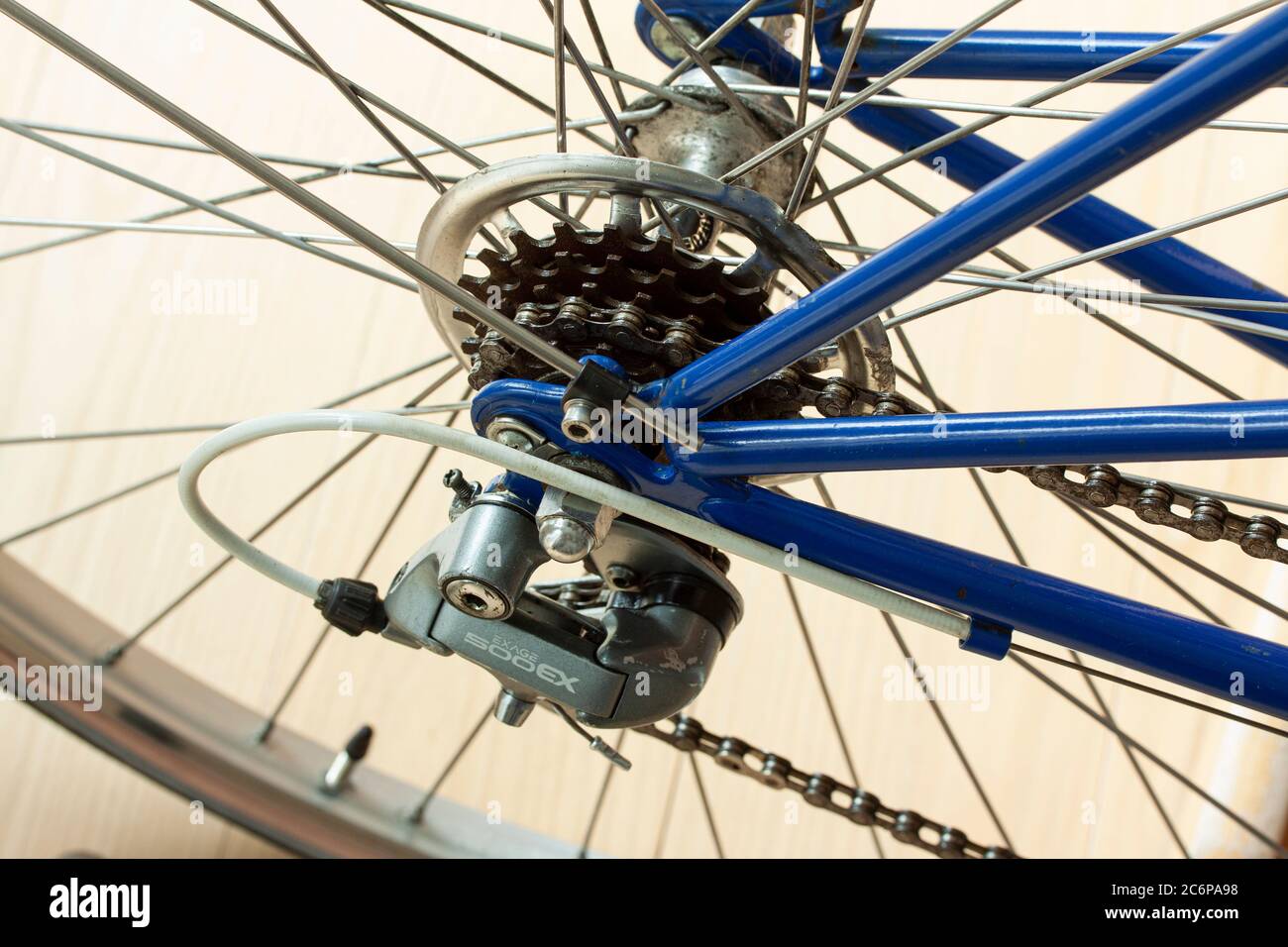 Shimano Exage 500 EX Rear Derailleur, spokes and chain on a sporty bicycle. Close-up image. Stock Photo