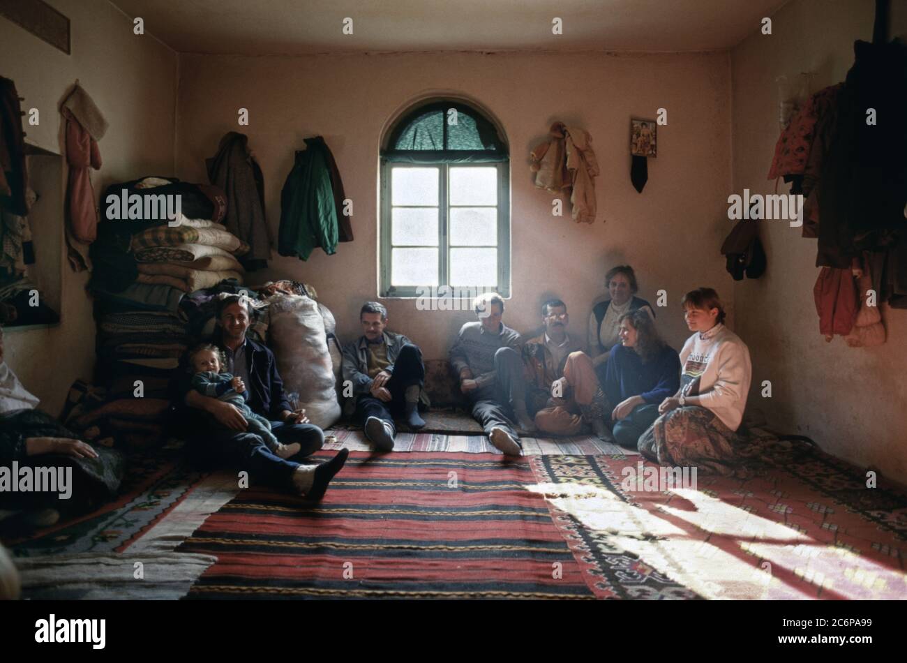 13th March 1994 During the war in Bosnia: displaced Bosnian Muslims share a room inside the village of Rotilj, where everyone is under detention by the Bosnian Croats. Stock Photo