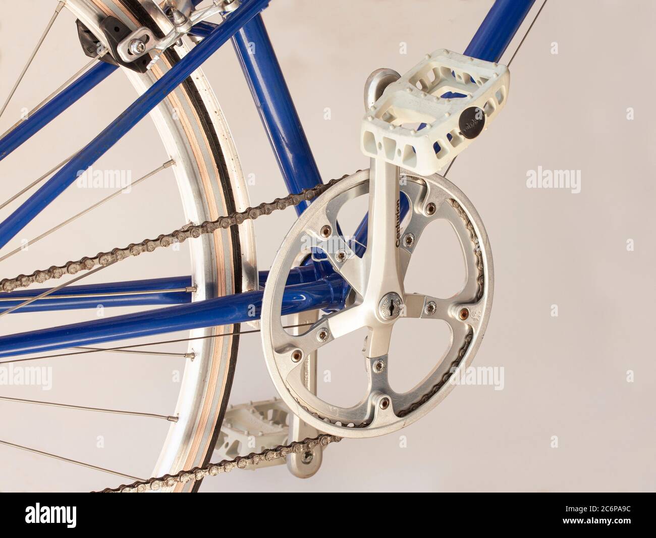 Sugino crankset, pedal and chain on a sporty blue bicycle. Close-up image  Stock Photo - Alamy