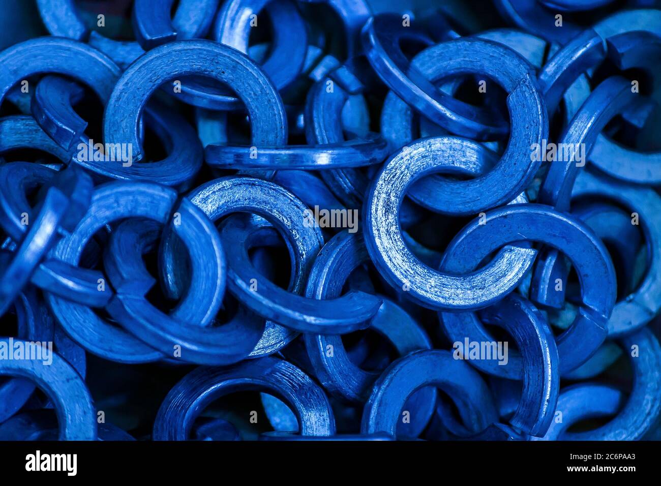 Texture of metal ringlets closeup in classic blue color Stock Photo