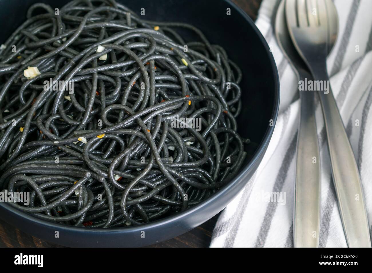 Bowl of Squid Ink Pasta with Garlic Squid ink spaghetti with olive oil