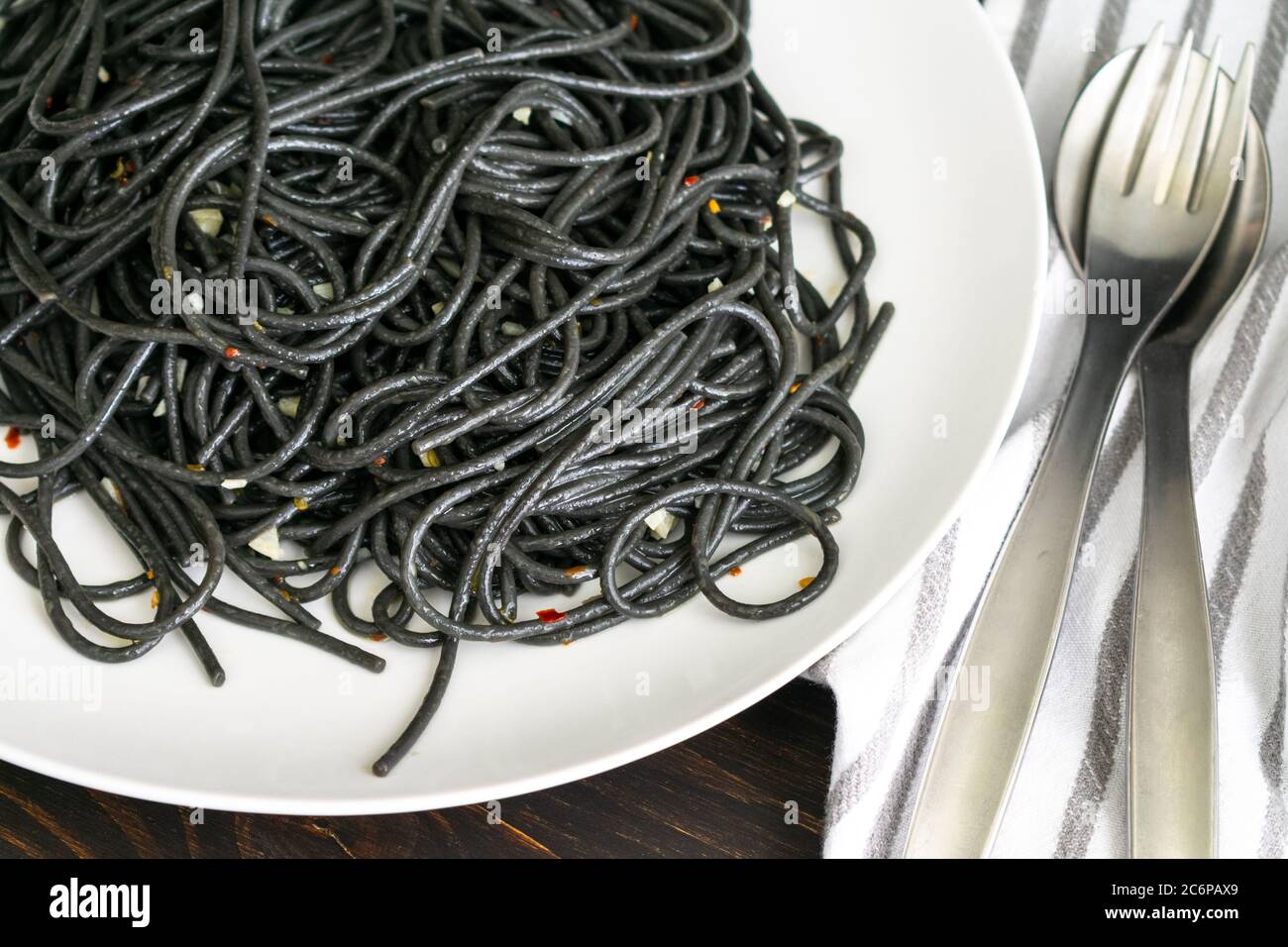 Plate of Squid Ink Pasta with Garlic Squid ink spaghetti with olive