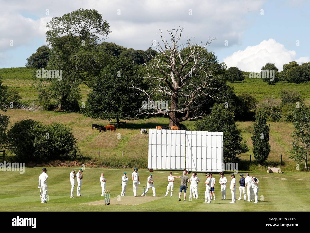Newtown Linford, Leicestershire, UK. 11th July 2020. Players of Newtown Linford and Oakham cricket clubs listen to a covid-19 briefing before play after the UK government relaxed coronavirus pandemic lockdown restrictions for several outdoor activities. Credit Darren Staples/Alamy Live News. Stock Photo