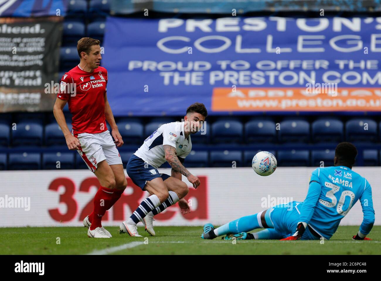 Deepdale Stadium, Preston, Lancashire, UK. 11th July, 2020. English Championship Football, Preston North End versus Nottingham Forest; Nottingham Forest keeper Brice Samba saves at the feet of Sean Maguire of Preston North End as Michael Dawson challenges Credit: Action Plus Sports/Alamy Live News Stock Photo