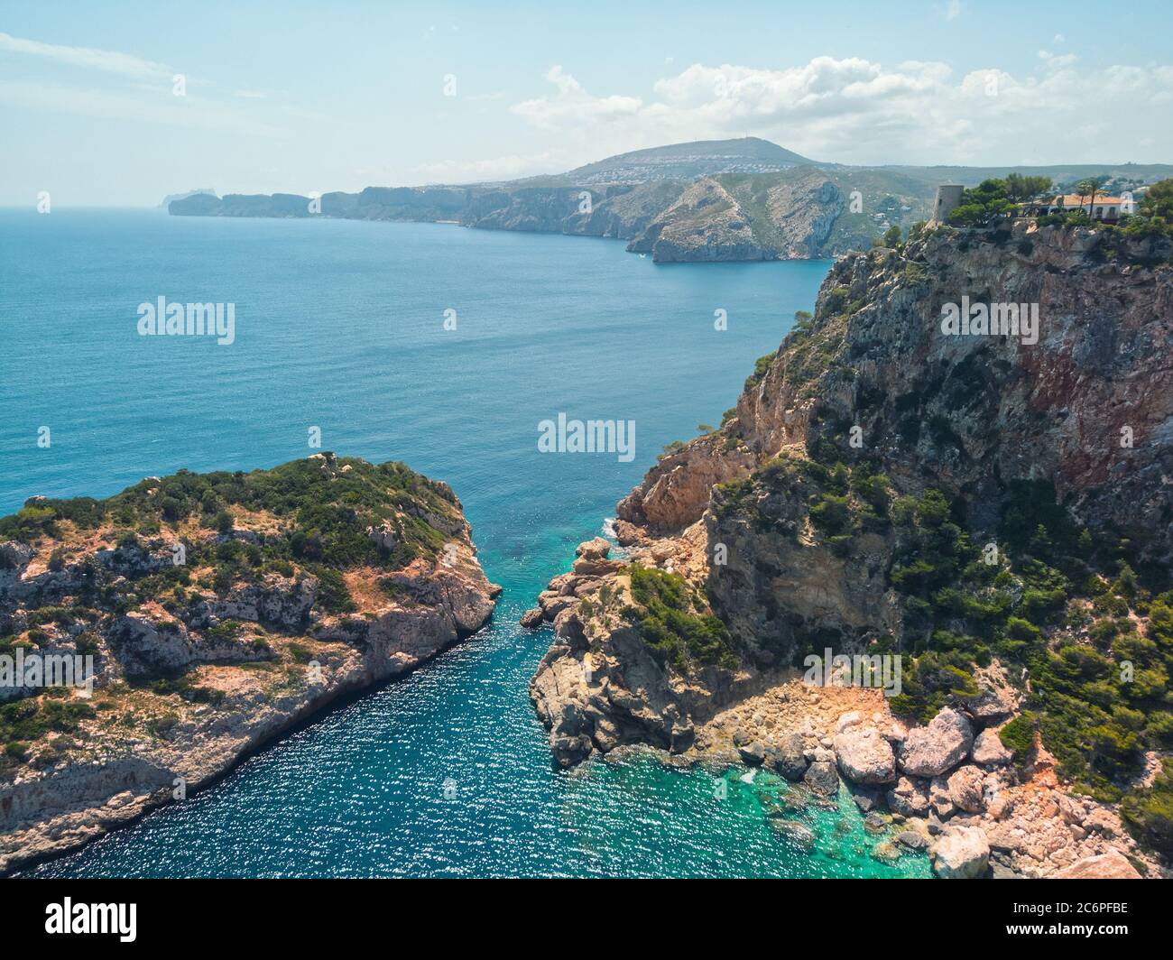 Aerial drone point of view photo picturesque turquoise bay green water lagoon of Mediterranean Sea, huge mountains, rocky coastline, idyllic scenery Stock Photo