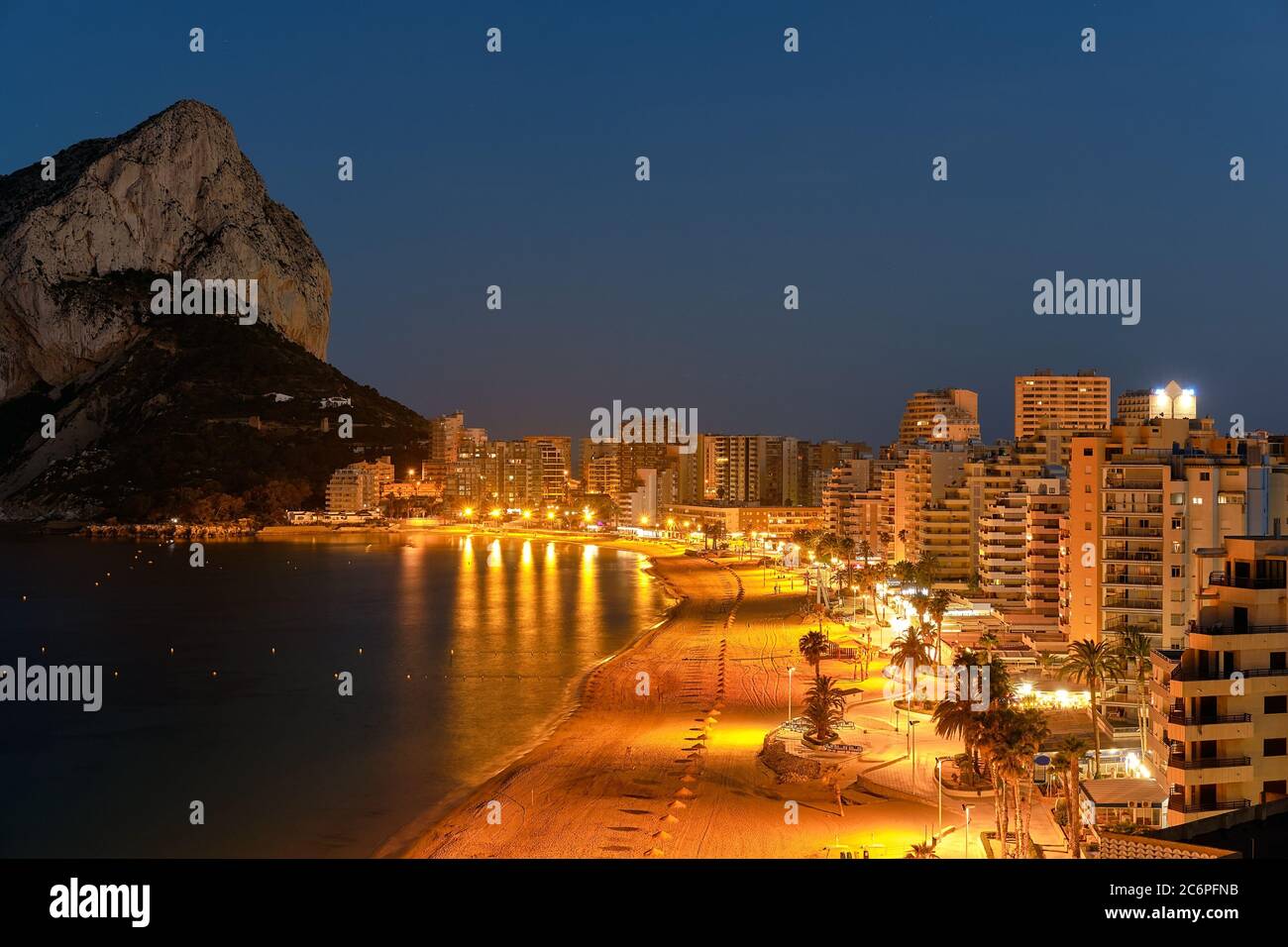 Cityscape panorama from above of Calpe. Night scene view street lights ...