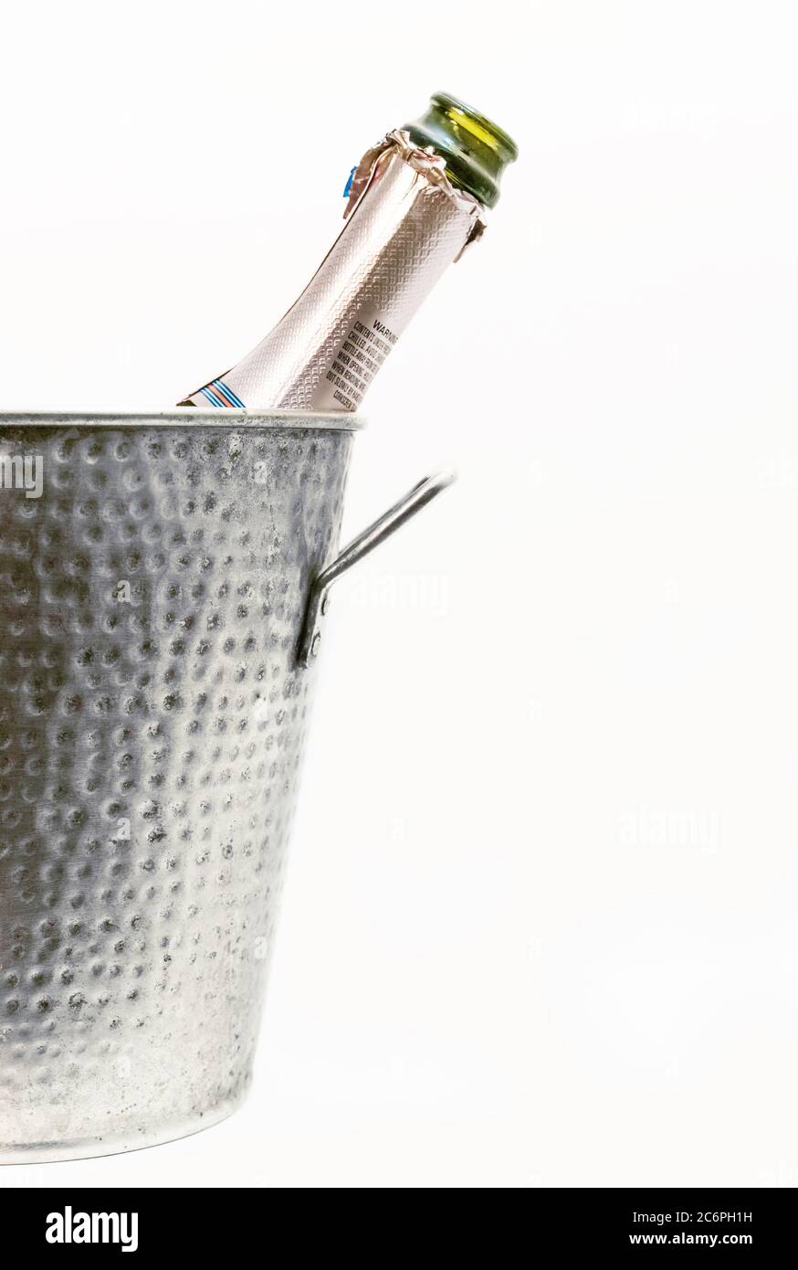 A champaign bottle or sparkling wine in the tin cooler. Stock Photo