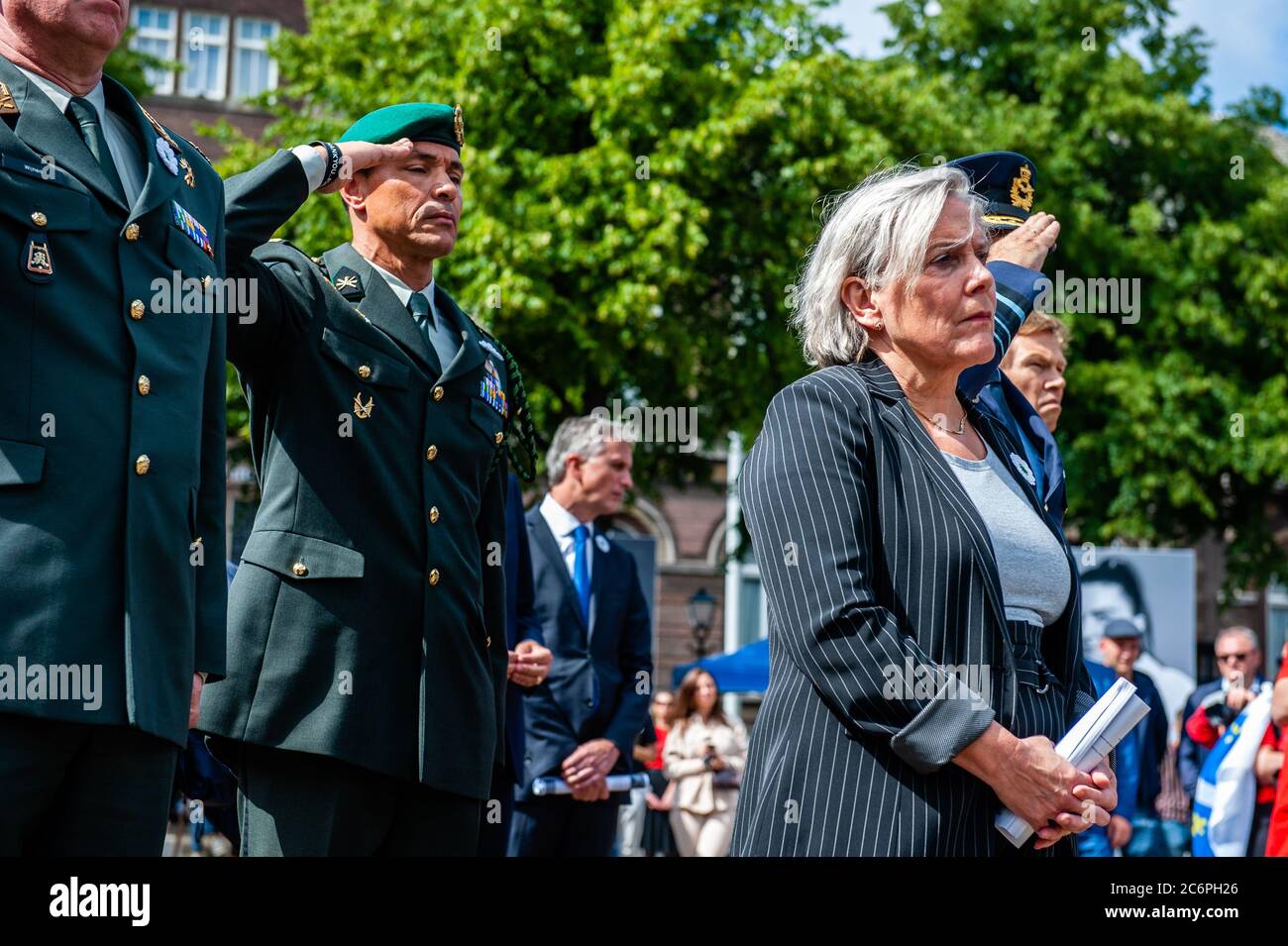 Minister of Defense Ank Bijleveld attends the ceremony.The National Memorial Srebrenica-Genocide is held every year on July 11 at Het Plein in The Hague since 1997. On this day, more than eight thousand victims of the genocide in Srebrenica are commemorated. Due to the Coronavirus situation, few people were allowed to stay at the square, the ceremony could be also followed via live stream. Former Minister Jan Pronk, and Minister of Defense Ank Bijleveld both gave a speech, and the names of the victims were read followed by a two minute moment of silence. This year the square was surrounded wit Stock Photo