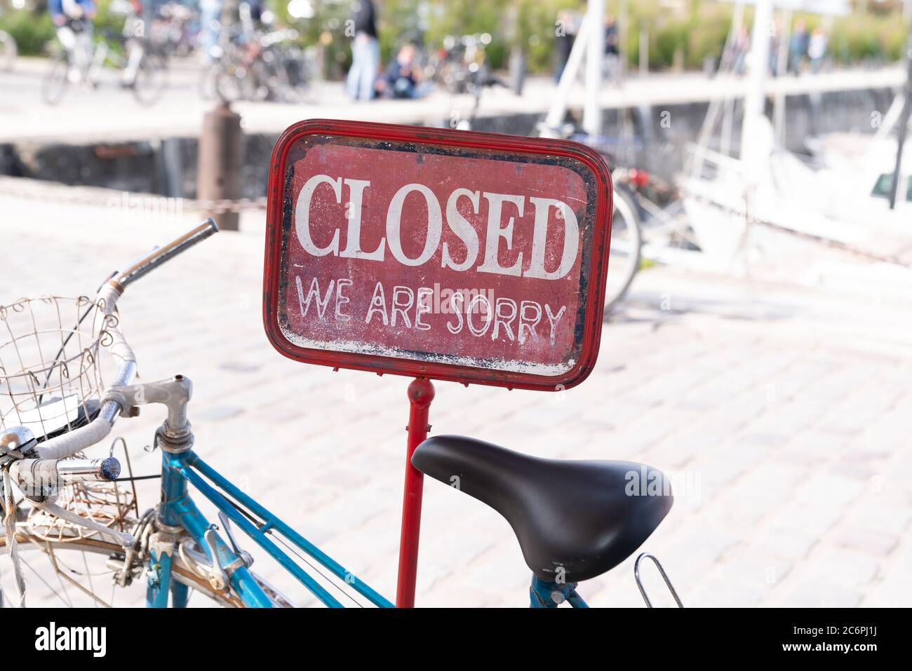 shop bar sign saying sorry we are closed on bike parked front restaurant in Ile de Re France Stock Photo