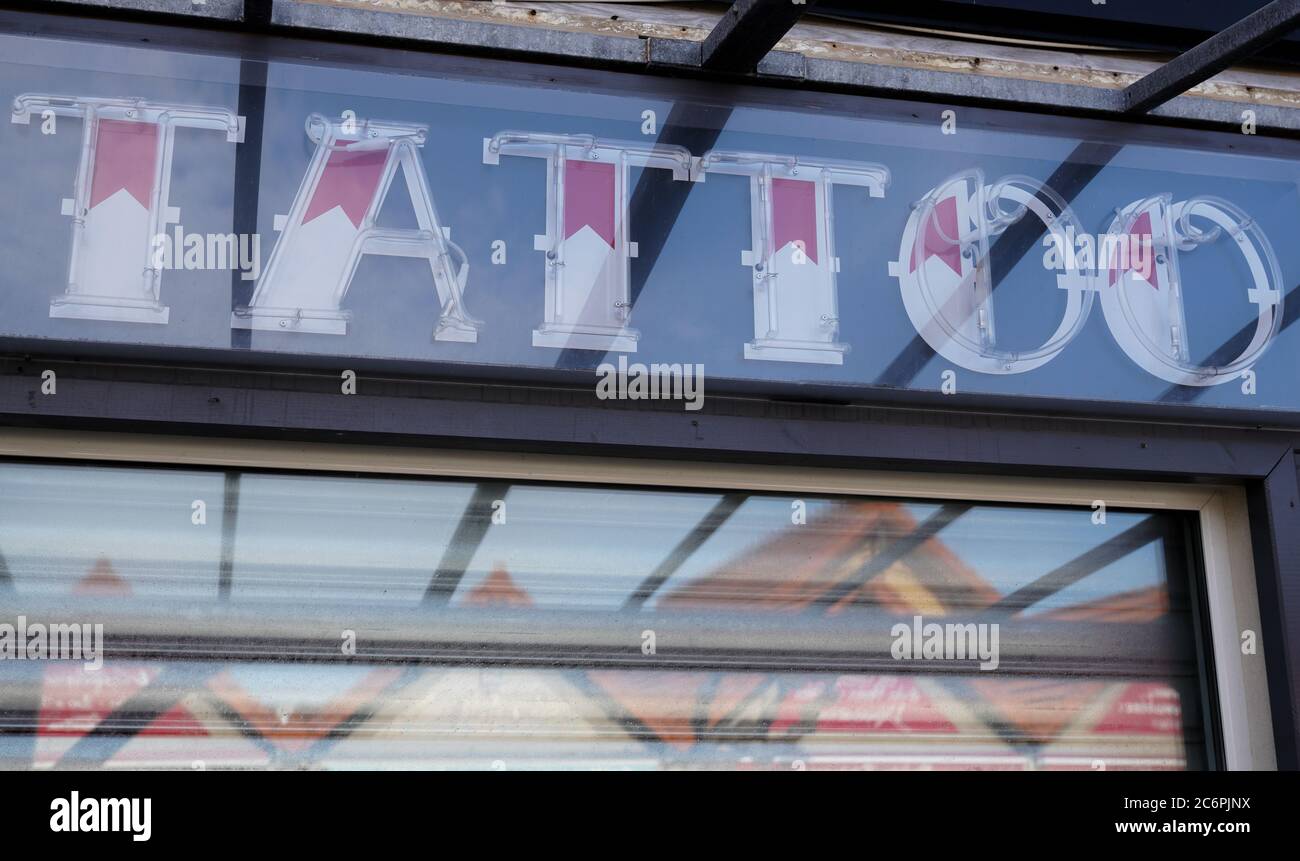 Shop window with Tatoo Shop sign store concept Stock Photo