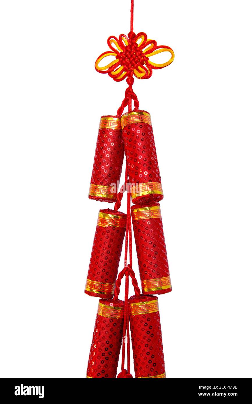 Red Chinese silk knot in form of fire cracker for celebriting new year (manual focus), isolated with clipping path Stock Photo