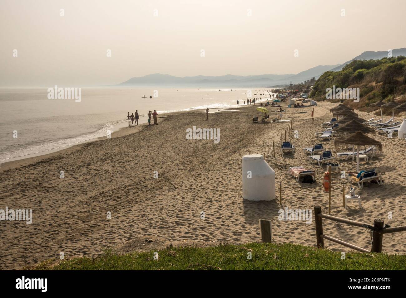 Spanish beach in at sunset, during Covid-19 restrictions, Marbella, Andalucia, Spain. Stock Photo