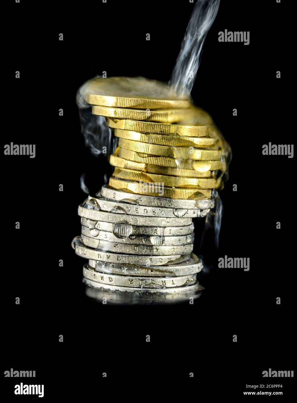 water running over a stack of Euro coins before black background Stock Photo