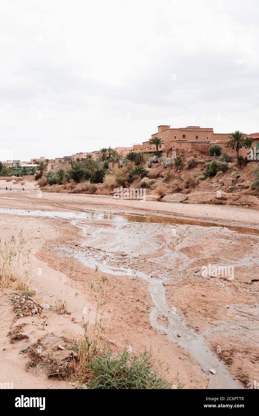 Red Rock Buildings at Aït Benhaddou, Morocco, Sit on the Edge of a Dry River Bed in the Desert. Stock Photo