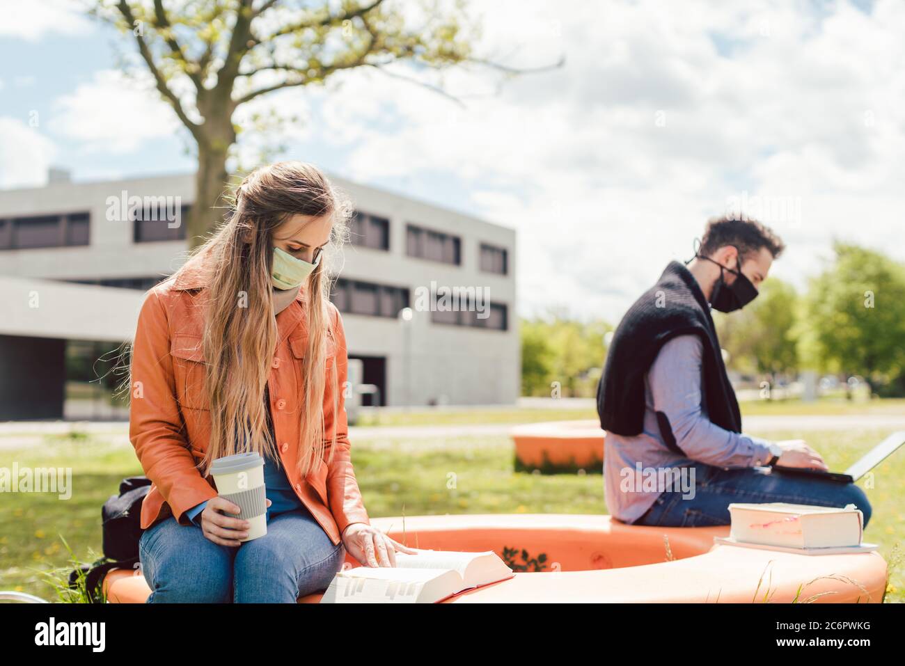 Students learning on campus keeping social distance Stock Photo