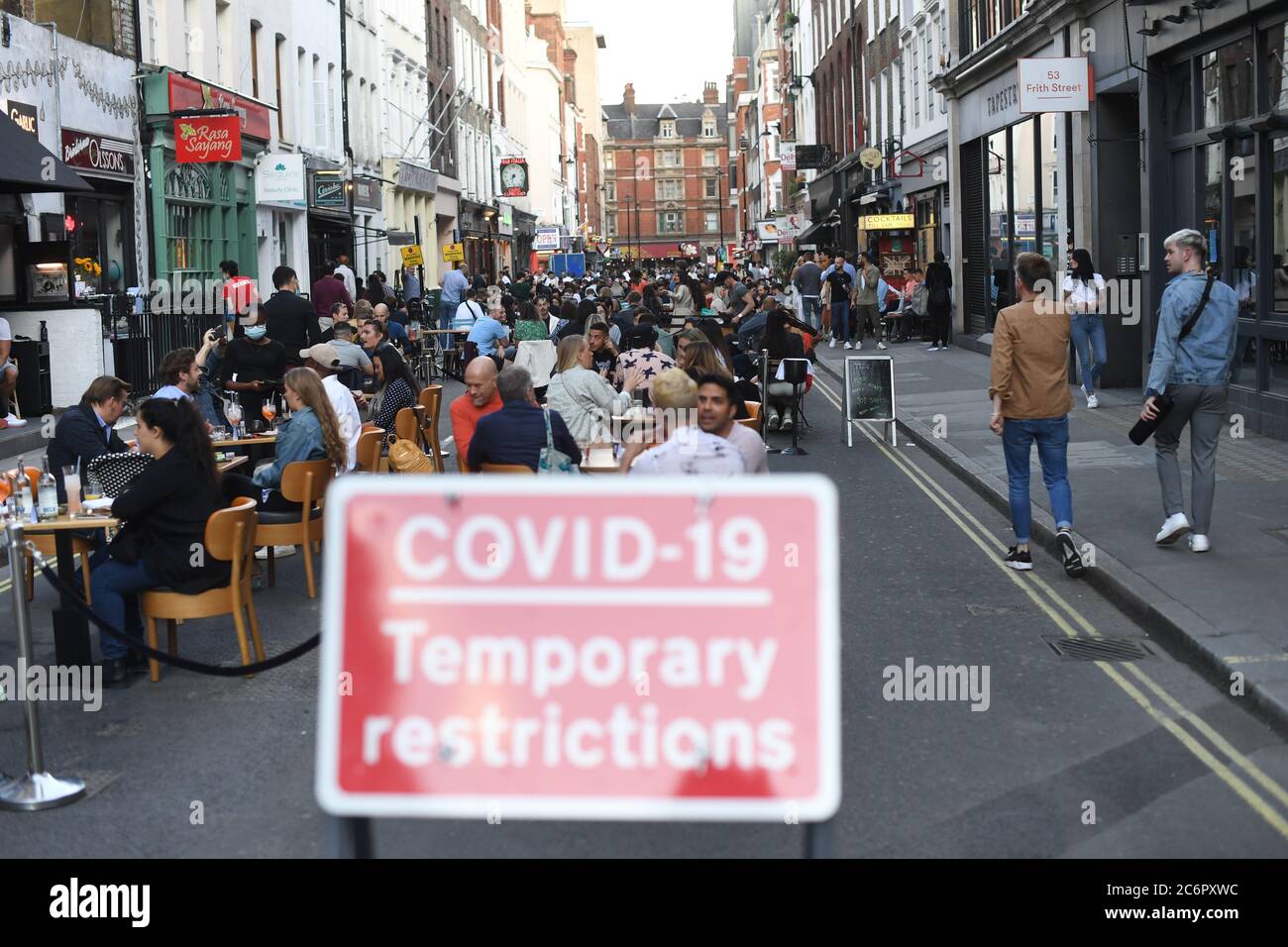 People socialising in Soho, central London, after the lifting of further coronavirus lockdown restrictions in England. Revellers are urged to remember the importance of social distancing as pubs gear up for the second weekend of trade since the lifting of lockdown measures. Stock Photo