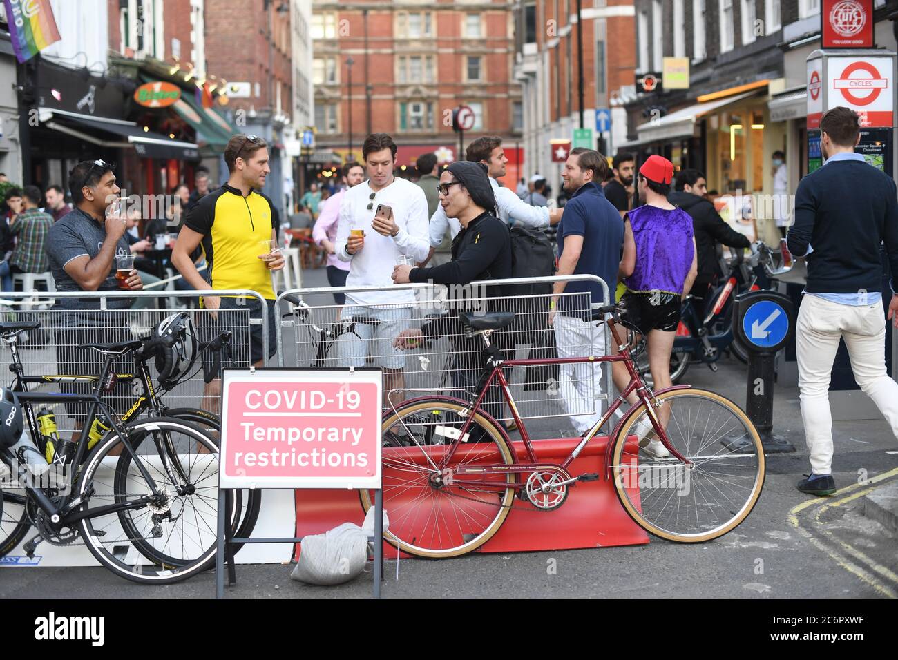 People socialising in Soho, central London, after the lifting of further coronavirus lockdown restrictions in England. Revellers are urged to remember the importance of social distancing as pubs gear up for the second weekend of trade since the lifting of lockdown measures. Stock Photo