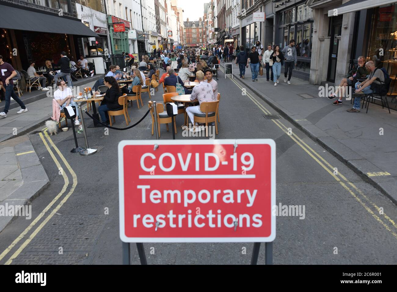 People socialising in Soho, central London, after the lifting of further coronavirus lockdown restrictions in England. Revellers are urged to remember the importance of social distancing as pubs gear up for the second weekend of trade since the lifting of lockdown measures. Stock Photo