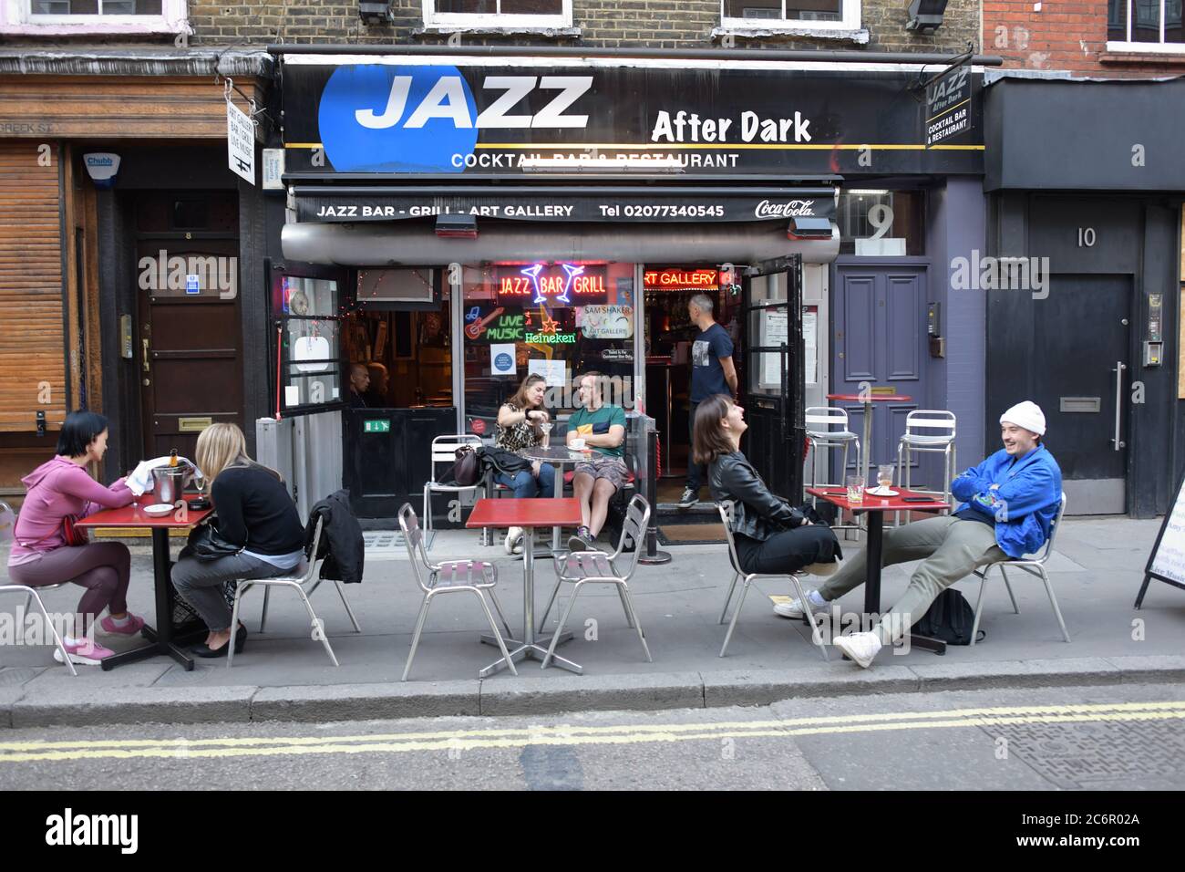 People socialising in Soho, central London, after the lifting of further coronavirus lockdown restrictions in England. Revellers are urged to remember the importance of social distancing as pubs gear up for the second weekend of trade since the lifting of lockdown measures. Stock Photo