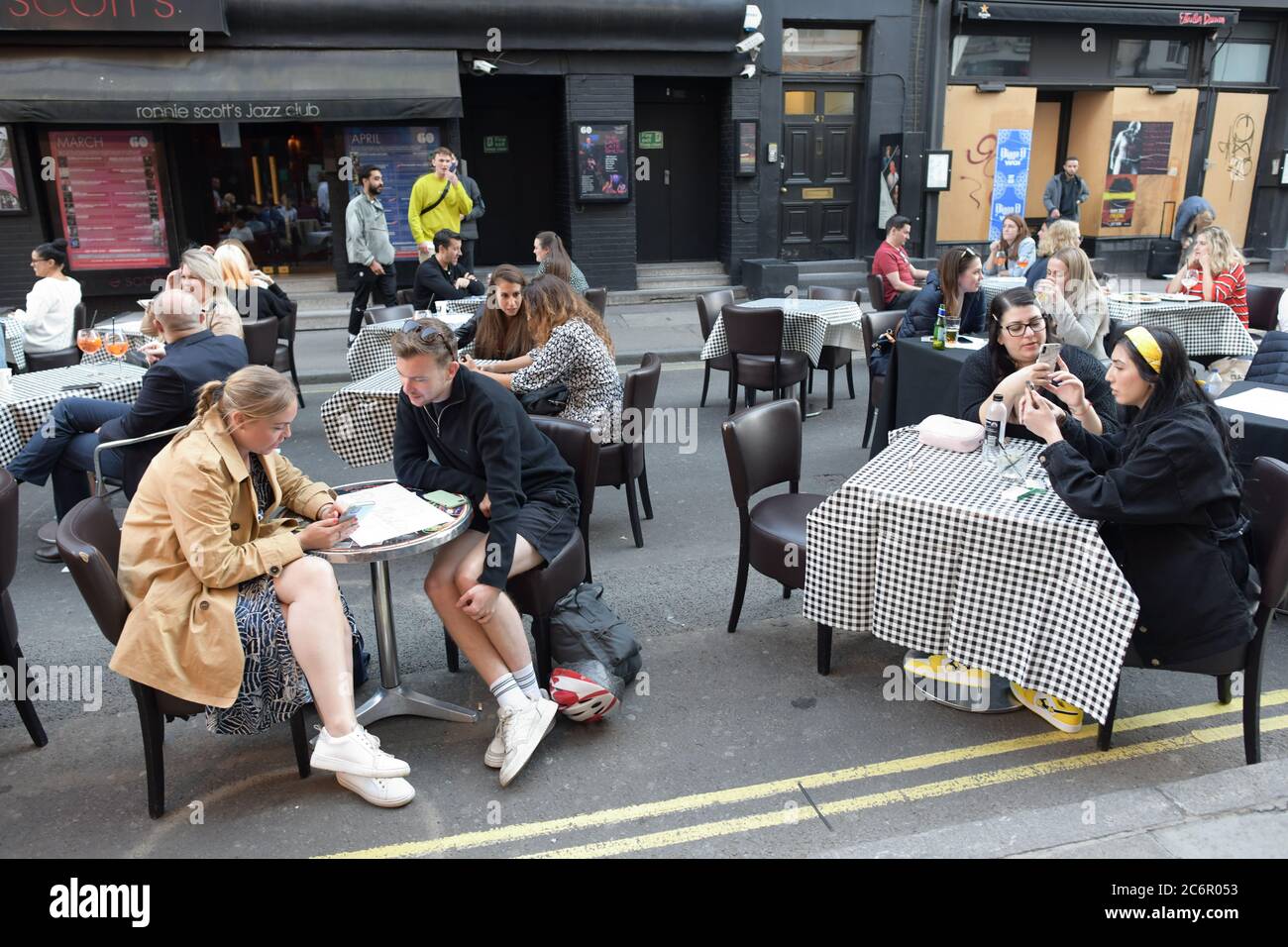 People socialising in Soho, central London, after the lifting of further coronavirus lockdown restrictions in England. Revellers are urged to remember the importance of social distancing as pubs gear up for the second weekend of trade since the lifting of lockdown measures. Stock Photo