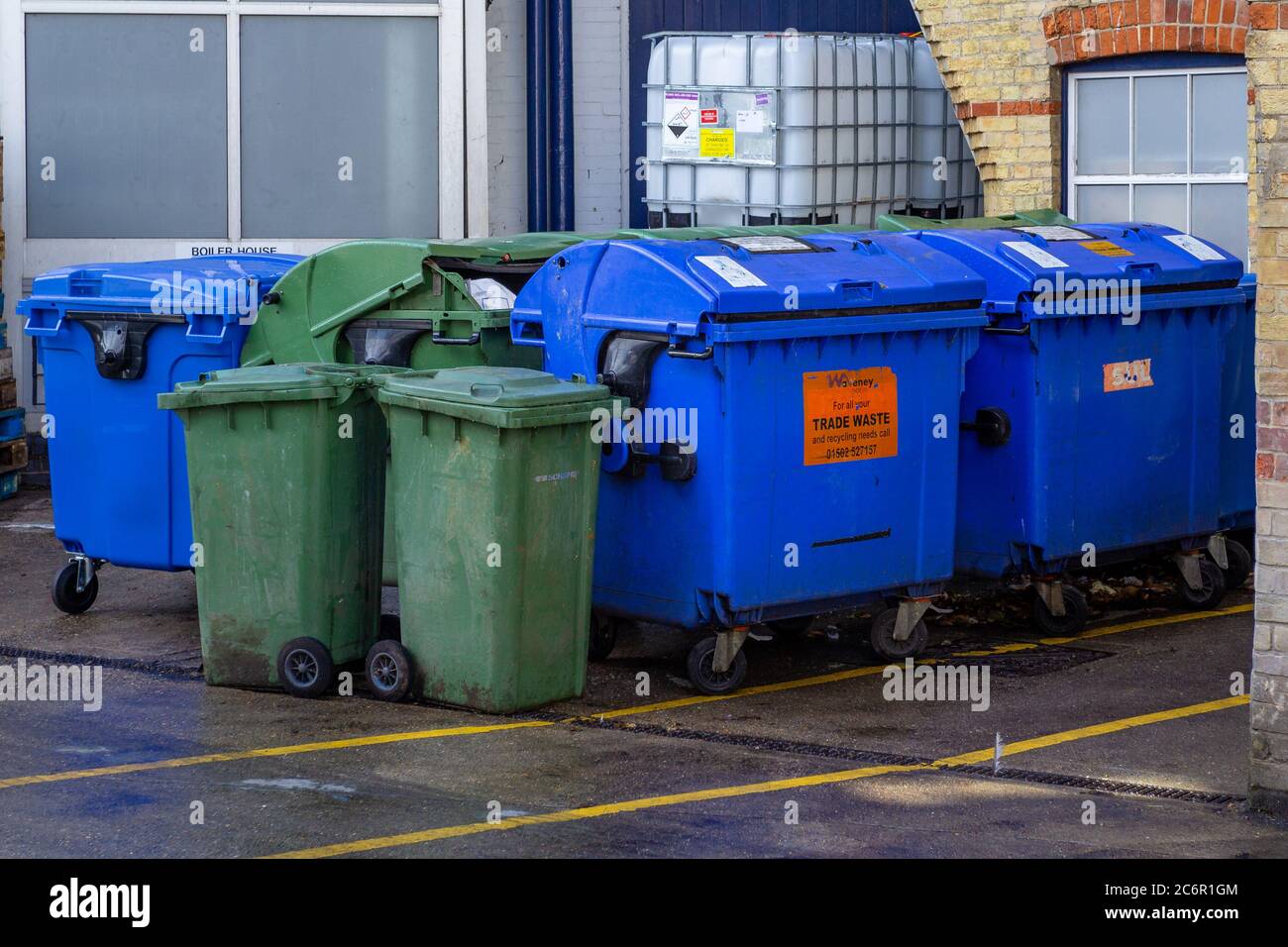 Line of large commercial wheelie bins Stock Photo Alamy