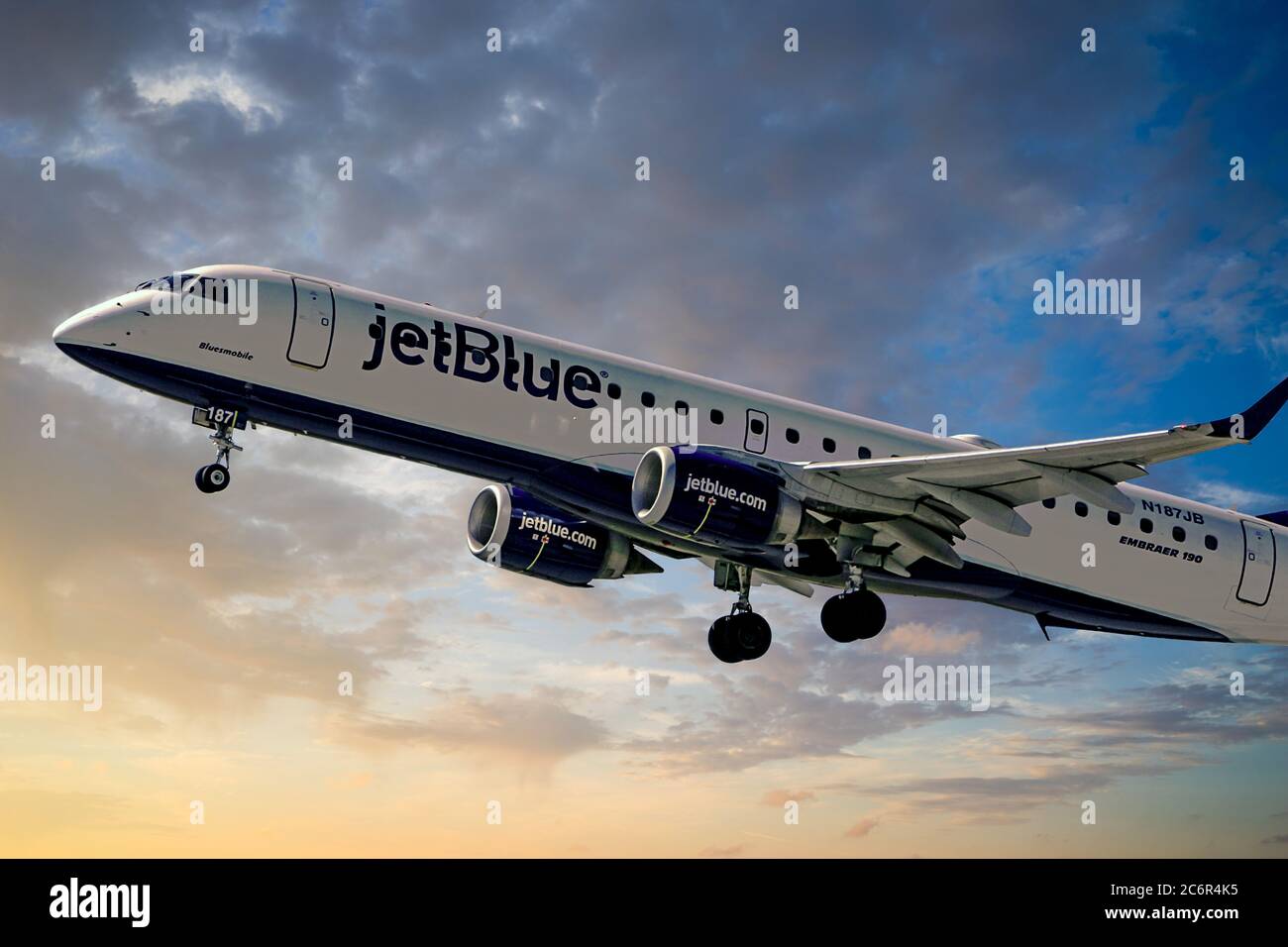 JetBlue Airlines CRJ190 climbs out after takeoff from Sarasota Airport in Florida Stock Photo