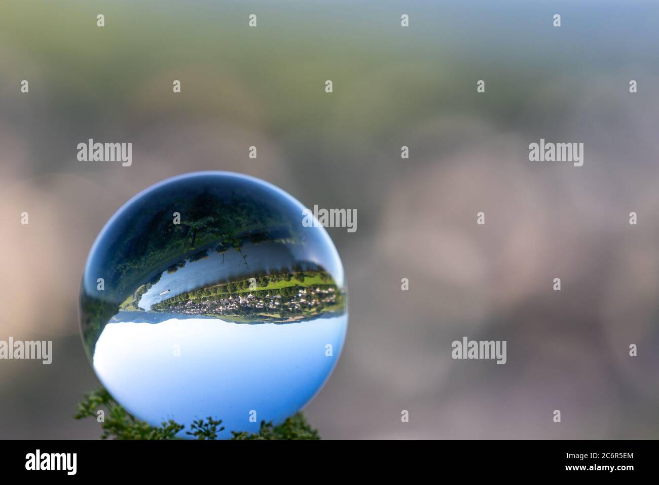 Crystal ball with lriver Moselle valley and defocused background Stock Photo