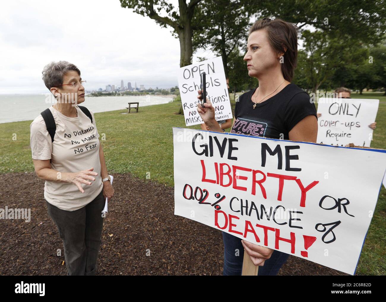 Cleveland, United States. 11th July, 2020. Janet Levitan, a local Physician, talks on Facebook live during a protest against Ohio's face covering order in the wake of the Coronavirus (COVID-19) at Edgewater Park in Cleveland, Ohio on Saturday, July 11, 2020. Photo by Aaron Josefczyk/UPI Credit: UPI/Alamy Live News Stock Photo