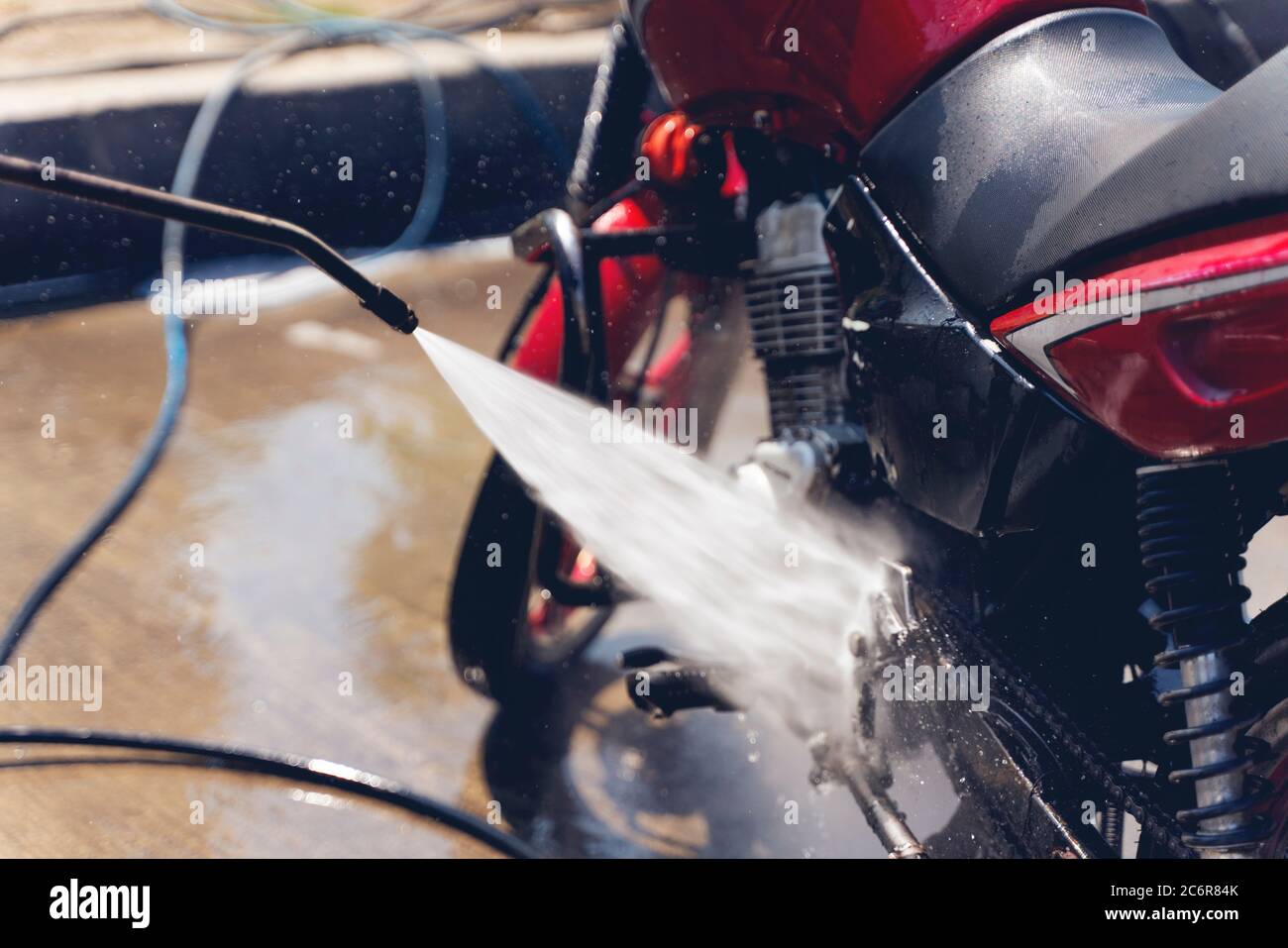 Motorcycle Car Wash Motorcycle Big Bike cleaning with foam injection Make  more clean. Bike rider washing his motorcycle Stock Photo - Alamy