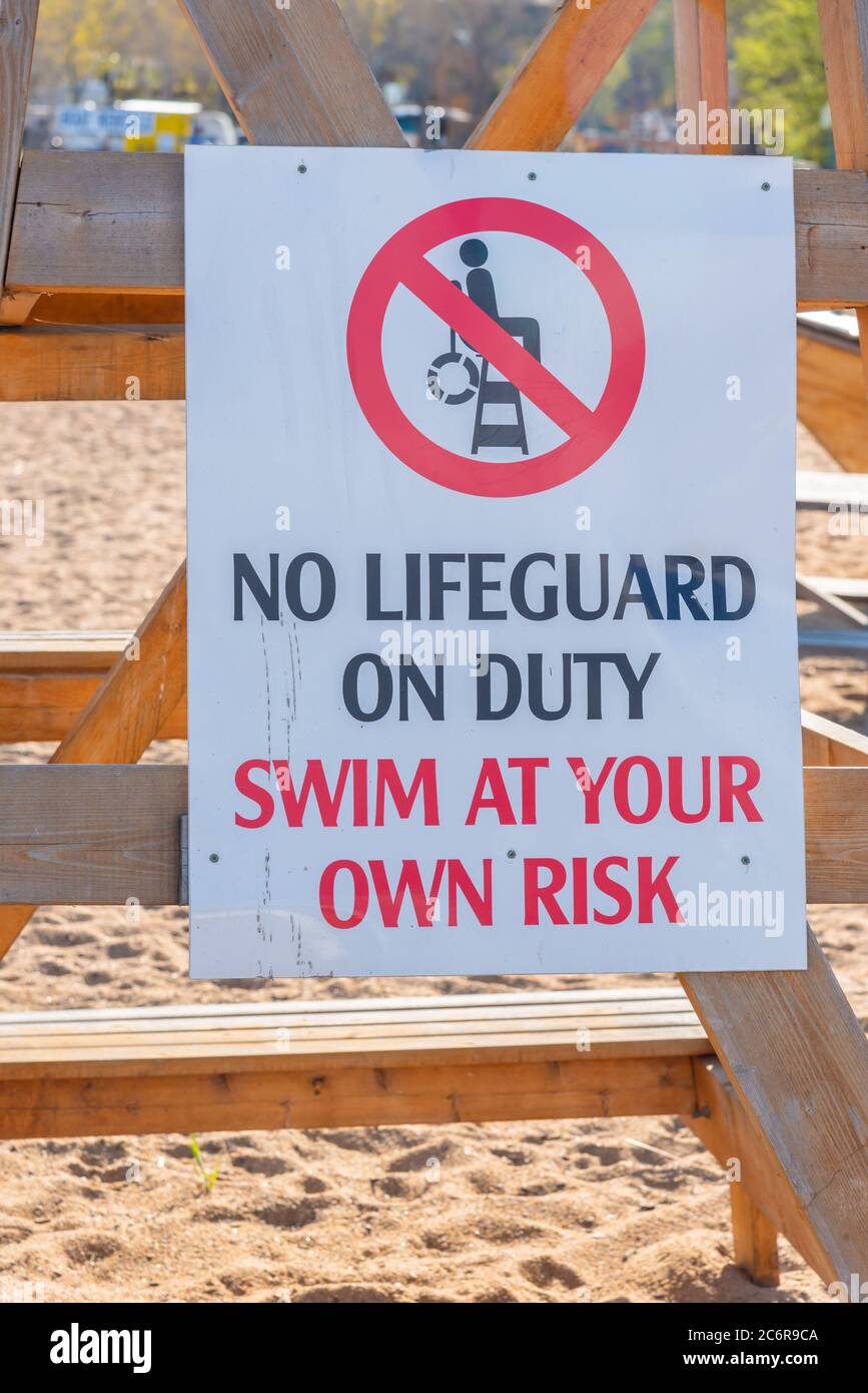 No lifeguard on duty sign on beach Stock Photo Alamy