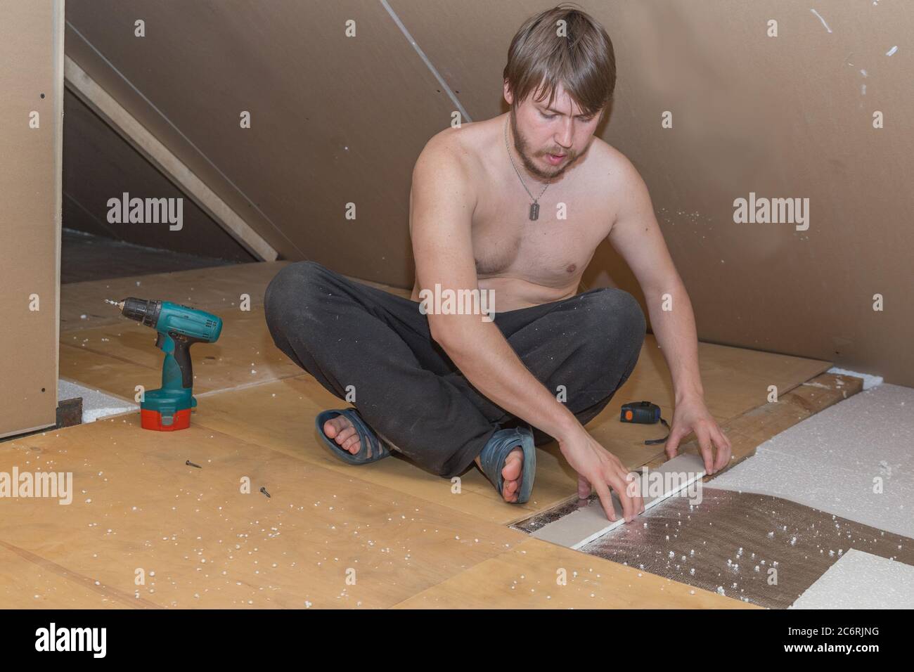 Installing insulation in attic hi-res stock photography and images - Alamy