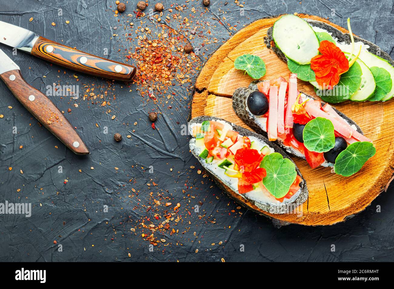 Summer bruschettas or canape with cream cheese,bacon and vegetables.Traditional italian bruschetta Stock Photo