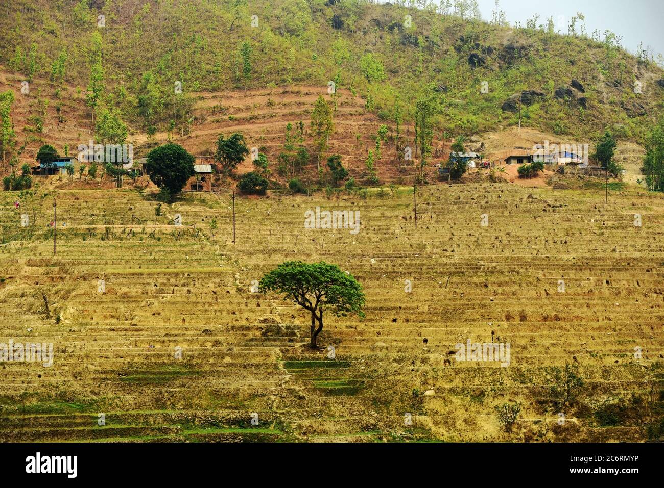 Dry agricultural fields of Nepal, seen from a road connecting Gandaki Pradesh and Bagmati Pradesh provinces. Stock Photo
