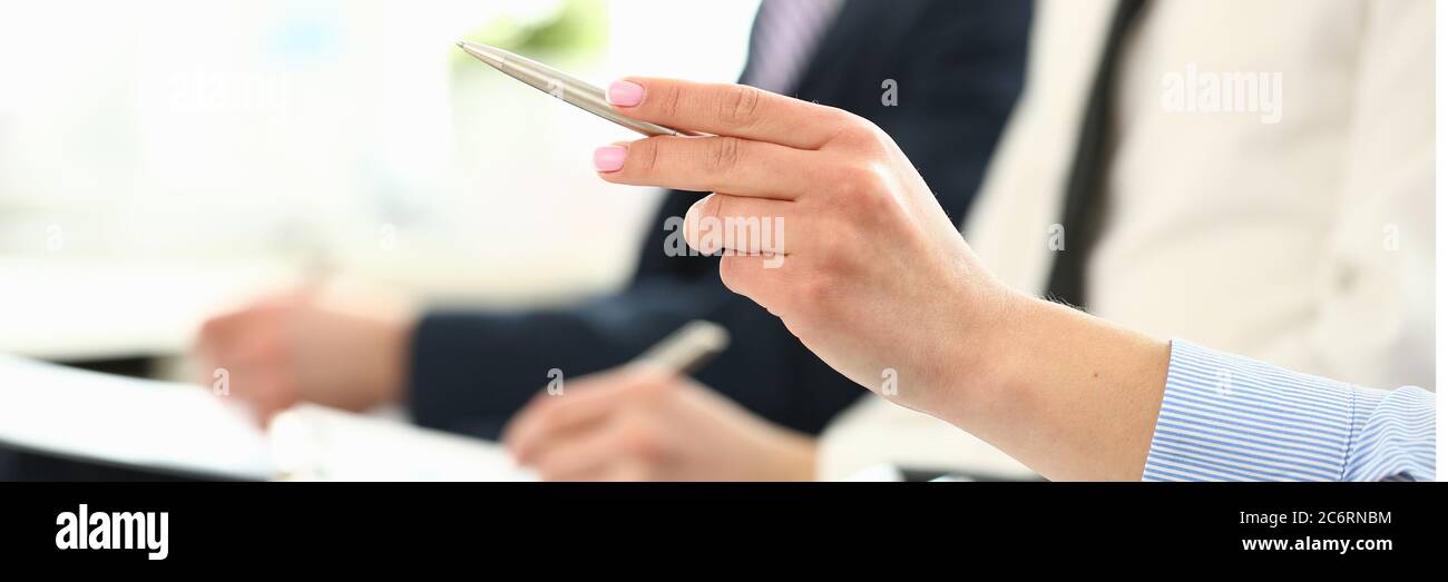 Bunch of people sitting in queue with clipboards and pens making some