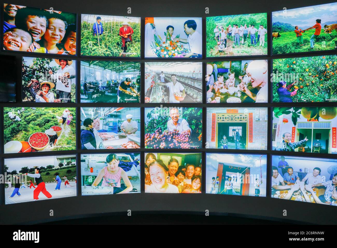 Chongqing. 22nd June, 2020. Photo taken on June 22, 2020 shows a photo wall displaying the happy life of people who have settled down after their relocation from the Three Gorges Reservoir area at the Three Gorges Migration Memorial in Wanzhou District, southwest China's Chongqing Municipality. Credit: Huang Wei/Xinhua/Alamy Live News Stock Photo